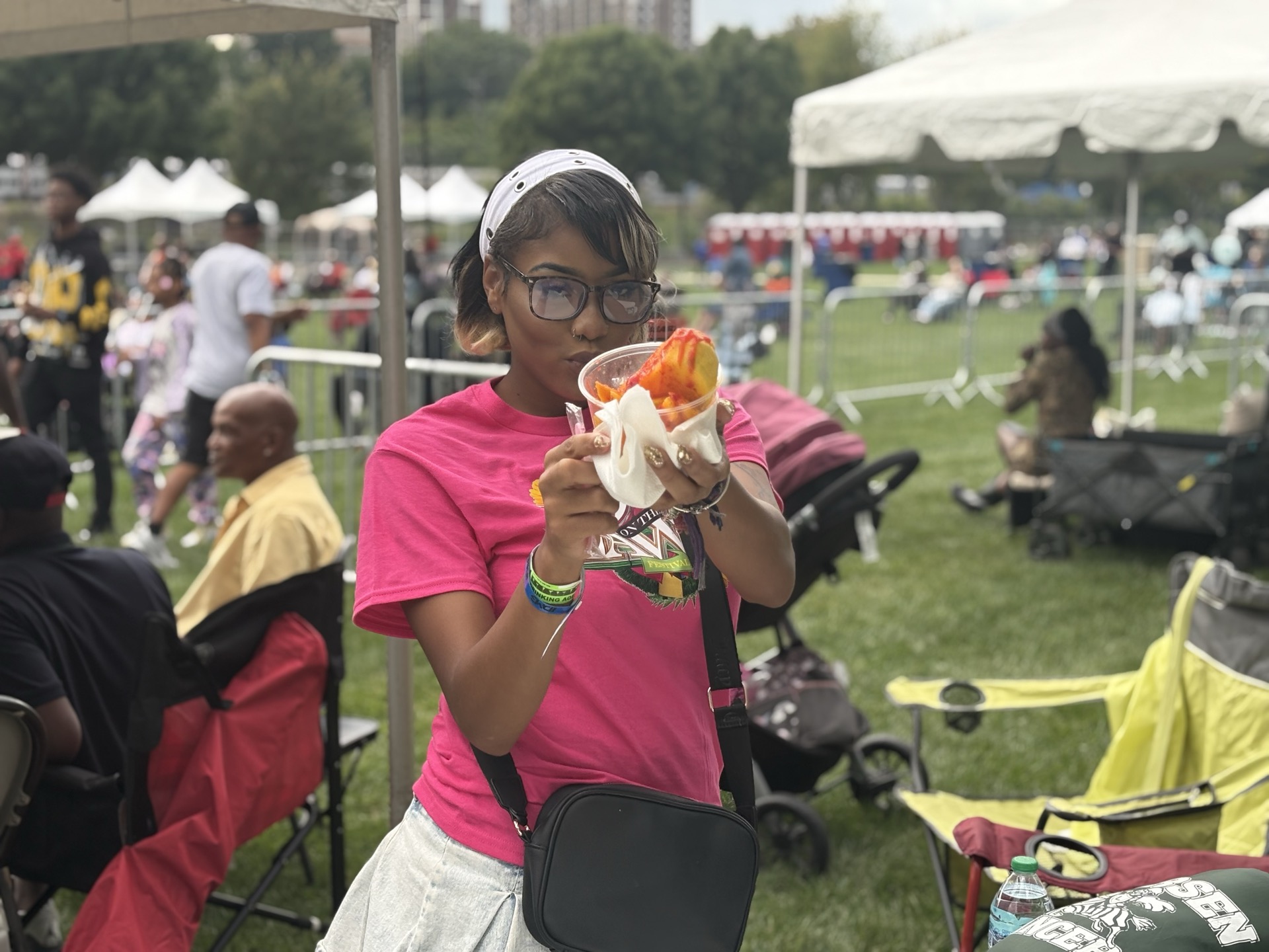 Fan enjoying food from the vendors