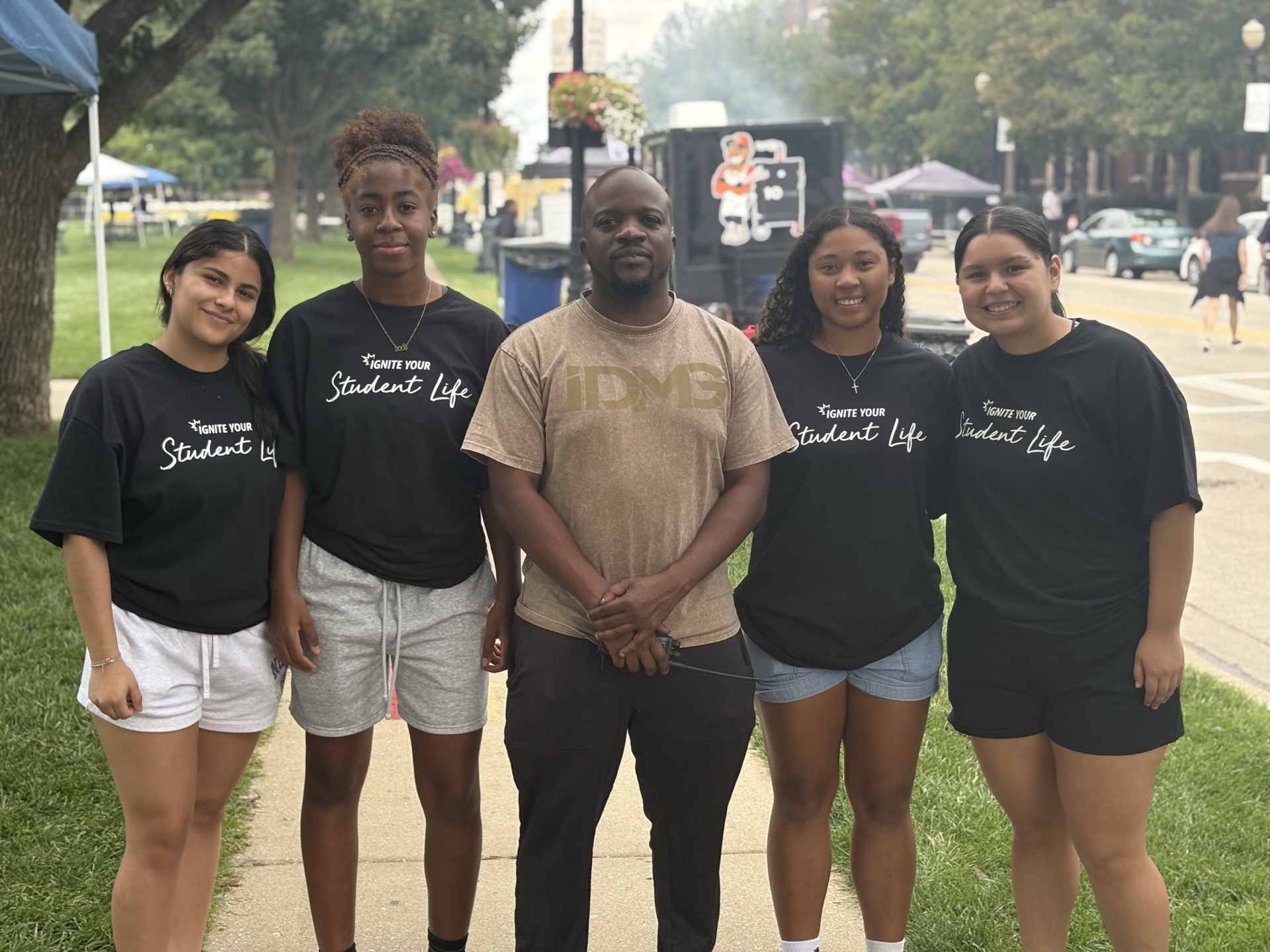 Festival organizer with student volunteers
